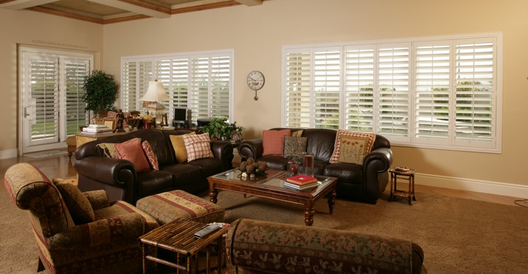 Bluff City sunroom with white shutters.